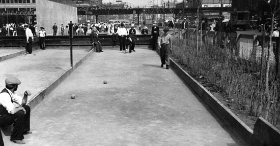 Men enjoy a game of bocce on the courts at 1st Avenue and East Houston, June 5, 1935. Courtesy of Parks Photo Archive, Neg. 1451.